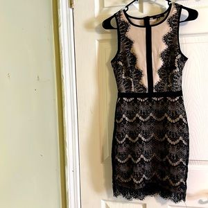 Unit sleeveless lace dress for women with a zipper on the back. Size XS.